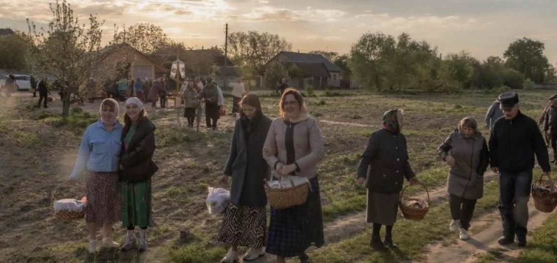 Orthodox believers carry traditional Easter baskets in the village of Krasne, Ukraine