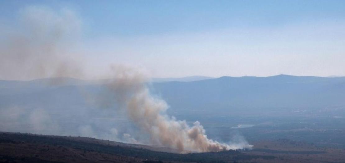 Smoke rises from one of the areas hit by missiles fired from northern Lebanon