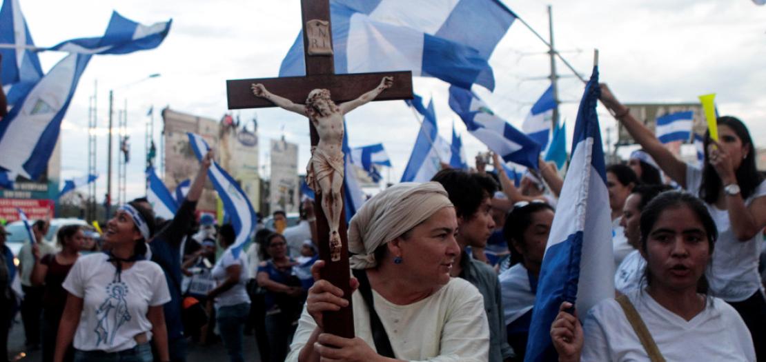 A demonstrator holds a crucifix during a protest against Nicaraguan President Daniel Ortega's government in Managua, Nicaragua (file photo)