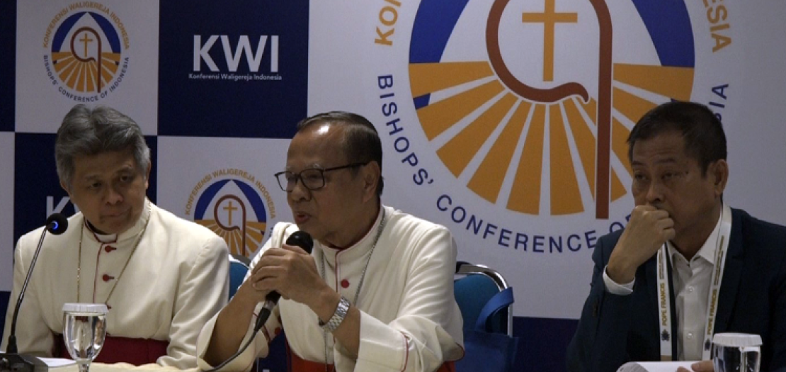 Cardinal Ignatius Suharyo addresses reporters during a press conference