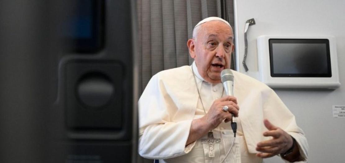 Pope Francis speaks with journalists aboard the return flight from Singapore  