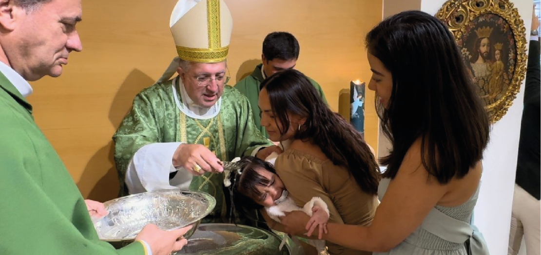 Bishop Ginés García Beltrán, who led the ceremony with17 children saved from abortion are baptized in Spain