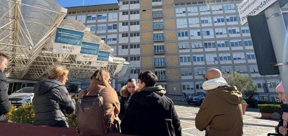 People waiting outside the Gemelli Hospital