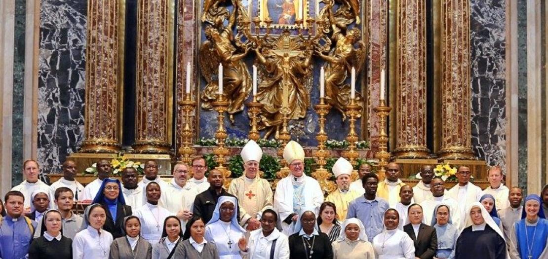 A prayer ceremony with a group of students who receive scholarships from the Papal Foundation 