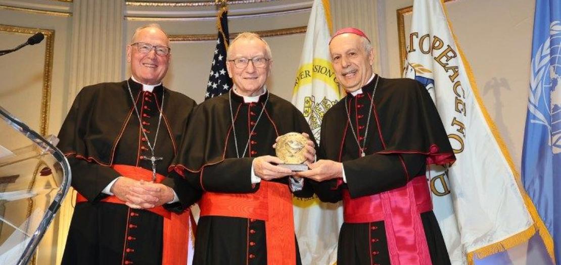 Cardinal Secretary of State Pietro Parolin accepts the award presented by the Path to Peace Foundation, established in 1991