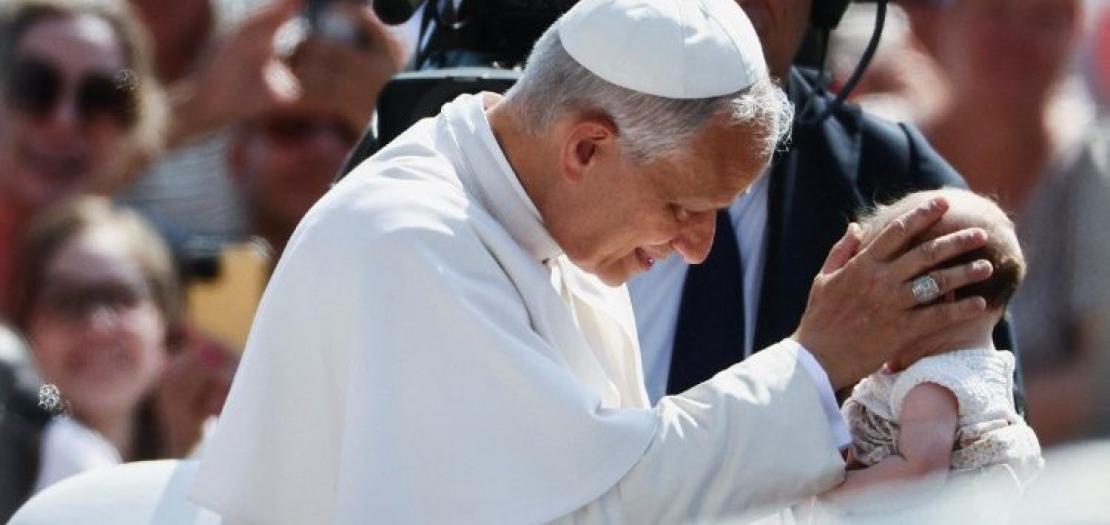File photo of Pope Leo XIV blessing a child at his weekly General Audience  