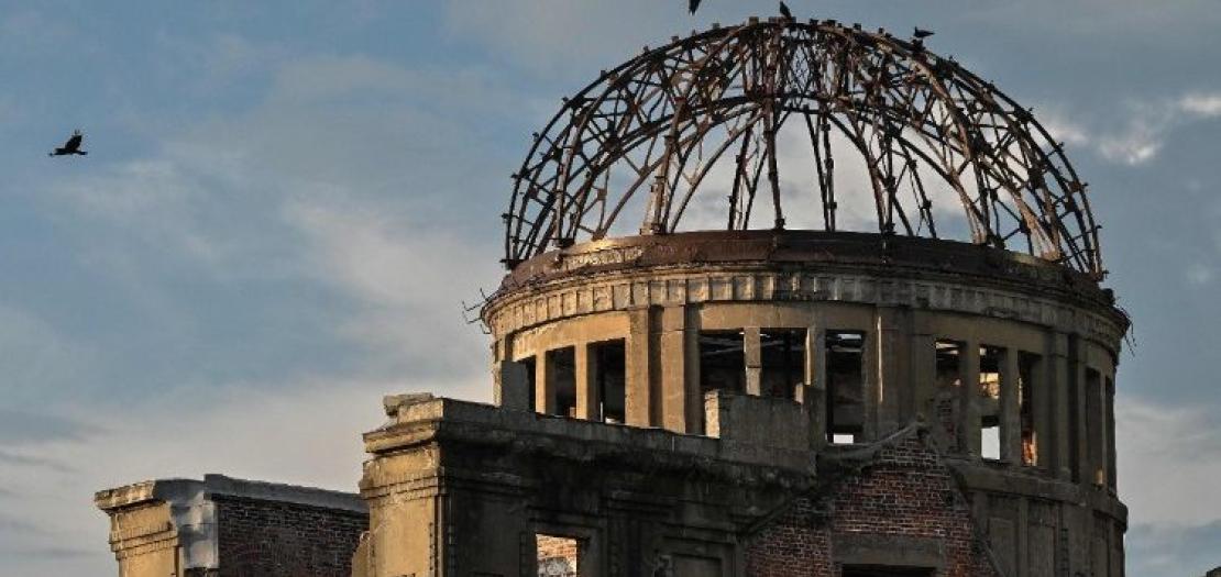 Crows fly around the top of the Atomic Bomb Dome on the eve of the 80th anniversary of the world's first atomic bomb attack, in the city of Hiroshima on August 5, 2025