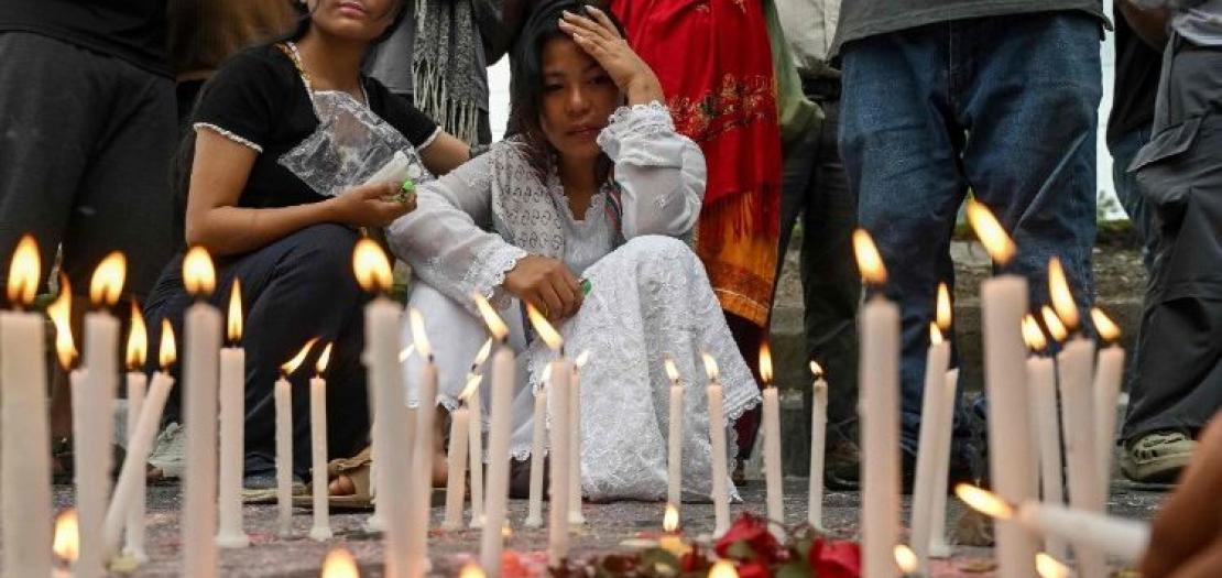Young people observe the National Day of Mourning in Kathmandu on September 17