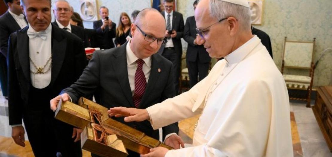 Pope Leo XIV blesses a cross during the audience with Aid to the Church in Need on October 10, 2025