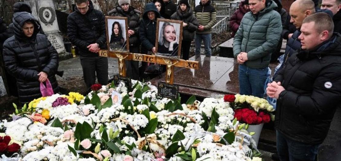 Mourners at the graves of those killed in a Russian missile attack on Ternopil on November 19.