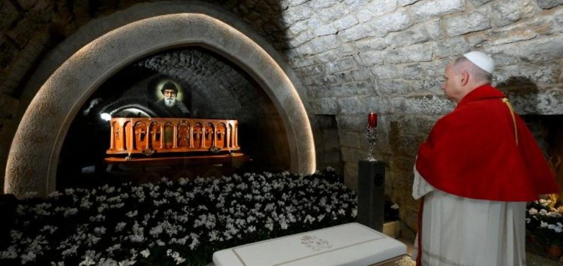 Pope Leo stands before the tomb of St. CharbelPope Leo stands before the tomb of St. Charbe