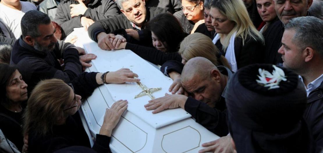 People mourn over the coffin of Father Pierre al-Rahi during his funeral in Qlayaa in southern Lebanon March 11, 2026.