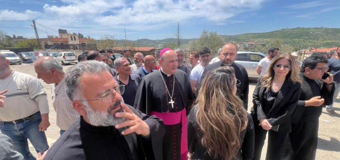 Father Fadi Felefli, left, Maronite Catholic parish priest at St. George Church in the village of Debel, southern Lebanon, and Archbishop Paulo Borgia, center, papal nuncio to Lebanon, accompany representatives of aid associations distributing humanitarian help to Christian villages in Debel in this photo posted April 25, 2026