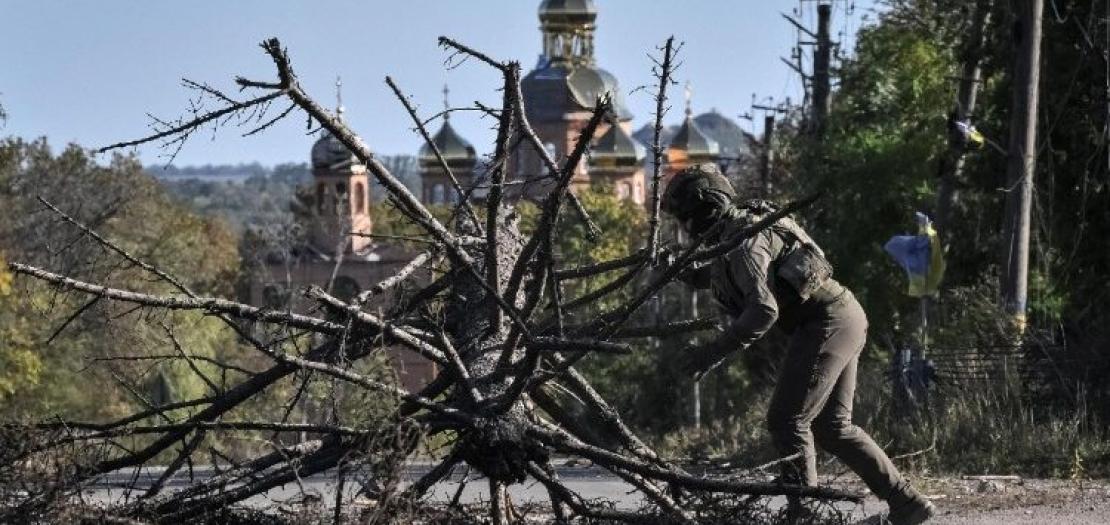 Ukrainian serviceman clears the road near the front line in Dnipropetrovsk region 